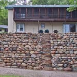Hardscape boulder retaining wall and steps
