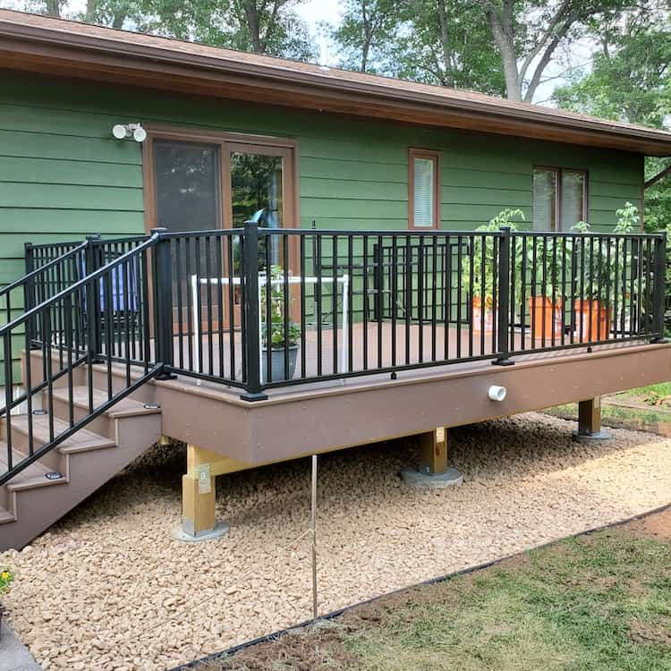 New deck with steps and iron rail from Majestic Creations Landscape
